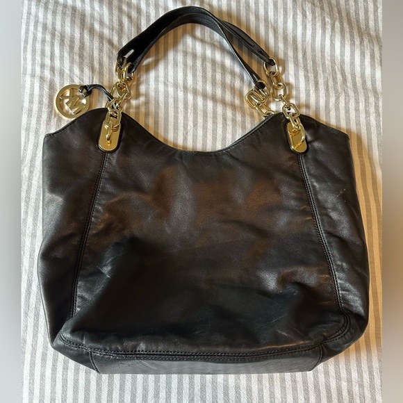 Adorable large black Michael Kors purse with soft leather gold hardware. - Picture 2 of 7